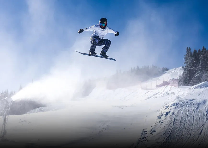 Senna Leith, Pro Snowboarder, US Snowboarding Team catching air while wearing Superfeet Winter insoles.